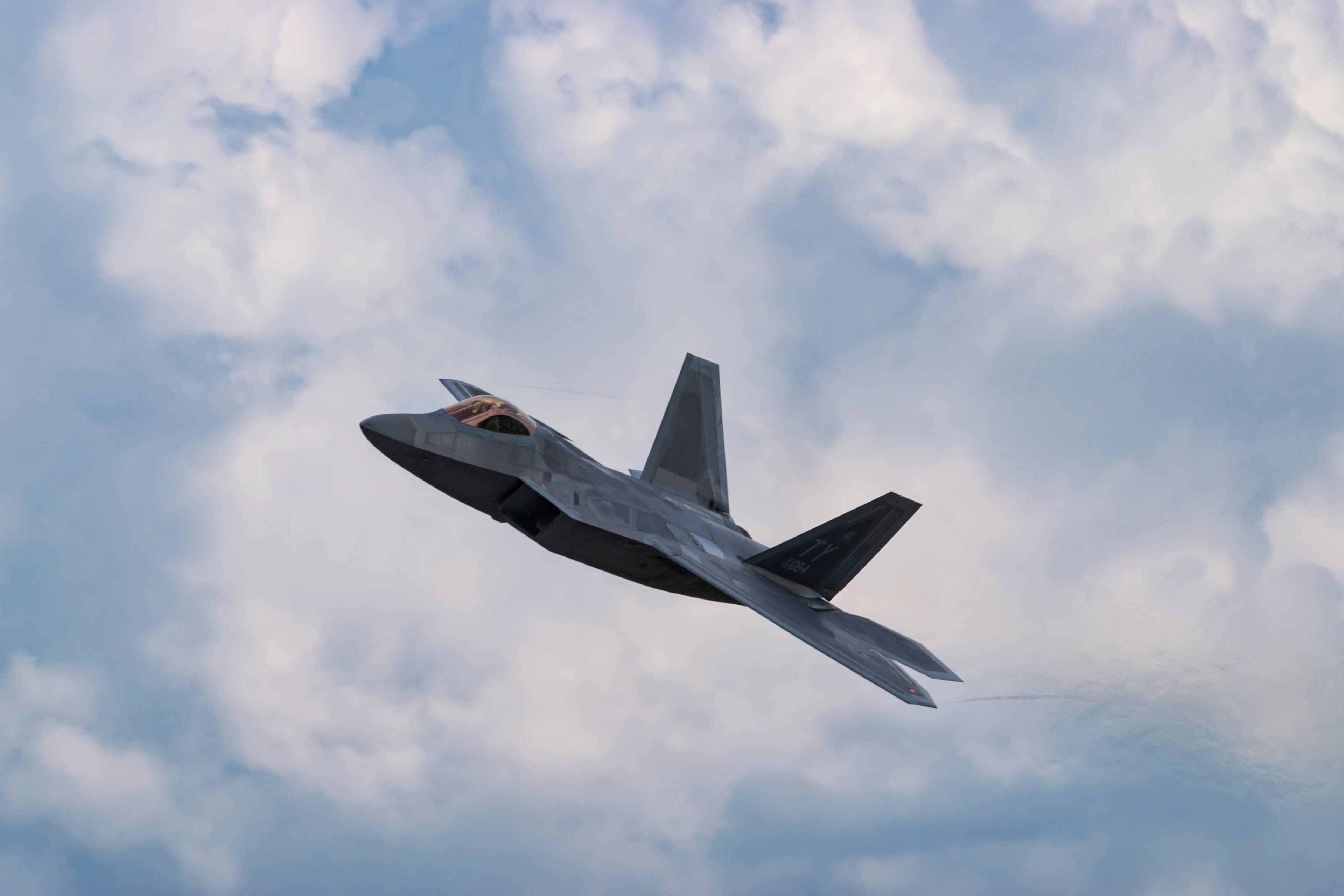 F-22 aircraft above the clouds